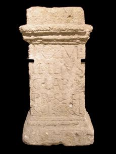 Narrow stone altar, with inscription