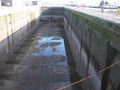 Lock emptied for maintenance – high water end of the lock.
