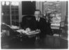 Calvin Coolidge seated at desk in Oval Office LOC3b39484r.jpg