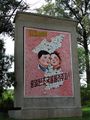 North Korean propaganda that states: "Let us pass on the united country to the next generation!".