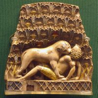 Plaque showing a lion biting the neck of a man lying on his back, one of the Nimrud ivories, Neo-Assyrian period, 9th–7th centuries BC