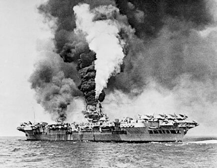 إتش‌إم‌إس Formidable on fire after a kamikaze attack on May 4. The ship was out of action for fifty minutes.
