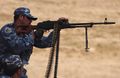 An Iraqi police officer fires a PKM while training with international police liaison officers and members of the Civilian Police Assistance Training Team at Forward Operating Base Marez in Mosul, Iraq, May 1, 2007.