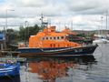 Lifeboats in Arklow Harbour, Ireland. Orange is chosen for lifeboats and lifesaving vests because of its high visibility.