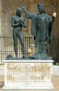 Statue depicting the baptism of Clovis by Saint Remigius.