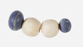 String of beads; 3650-3100 BC; lapis lazuli (the blue beads) and travertine (the white beads) (Egyptian alabaster); length: 4.5 cm; by Naqada II or Naqada III cultures; Metropolitan Museum of Art (New York City)