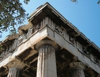 The entablature of the Hephaisteion (temple of Hephaistos) in Athens, showing Doric frieze with triglyphs and sculpted metopes.
