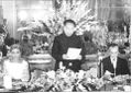 Hua Guofeng, the Premier of the People's Republic of China, seen giving a speech during a state dinner in Tehran as Mohammad Reza Pahlavi, the Shah of Iran, and his consort, Shahbanu Farah Pahlavi listen, 1979.