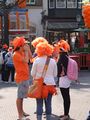 Celebrating Queensday in Amsterdam. The Royal family of هولندا belong to the House of Orange.