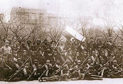 Officers and soldiers of the army of the Azerbaijan Democratic Republic against the background of the state tricolour