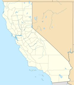 Located in California, close to the midpoint of the diagonal border between California and Nevada