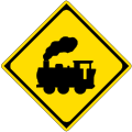 Traffic signs often use silhouettes. This sign warns that the road crosses a railway line.